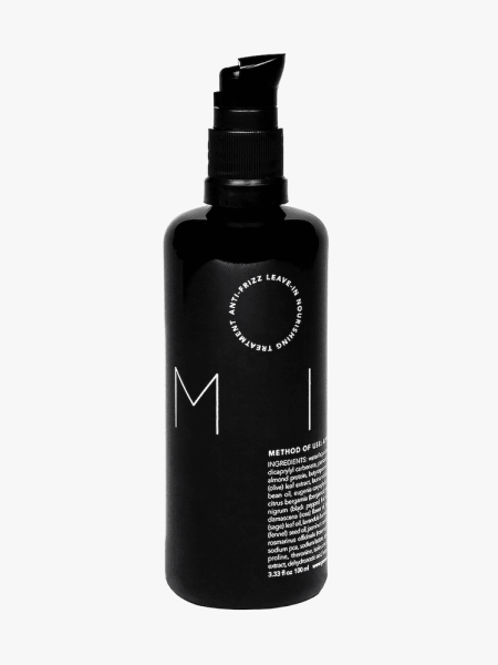Reverie Milk Anti-Frizz Leave-In Nourishing Treatment in black bottle